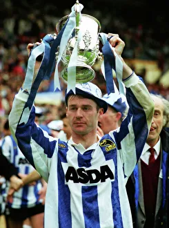 Sheffield Wednesday goalscorer John Sheridan holds aloft the League Cup trophy in 1991 Sheffield Wednesday goalscorer John Sheridan holds aloft the League Cup trophy in 1991