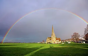 Seasonal weather - Rainbow over All Saints Church, Blackheath, London, UK Seasonal weather - Rainbow over All Saints Church, Blackheath, London, UK