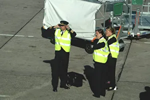 Aer Arran flight crew protecting hearing whilst standing on tarmac at Cork Airport Aer Arran flight crew protecting hearing whilst standing on tarmac at Cork Airport