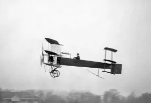 Black and white print of Mr A.V. Roe in his 1909 Avro Triplane aircraft