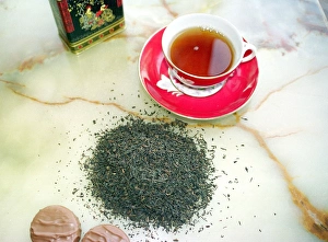 Black Tea Prints: Cup of black tea with chocolate biscuits