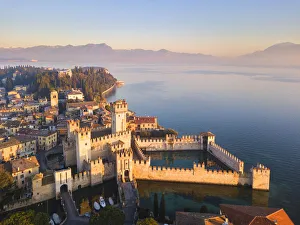 Aerial view at dawn of Sirmione village in Garda lake, Lombardy district Aerial view at dawn of Sirmione village in Garda lake, Lombardy district