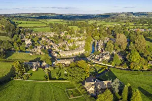 Aerial view over the village of Lower Slaughther in the Cotswolds, Gloustershire, England Aerial view over the village of Lower Slaughther in the Cotswolds, Gloustershire, England