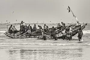 Dakar Collection: Africa, Senegal, Kayar. Fishermen with their boat going out