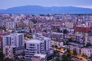 Prints of Albania, Vlora, elevated city view, dusk Albania Prints: Albania, Vlora Elevated City View Print at Dusk