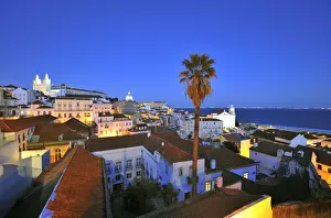 Alfama at dusk, seen from the Portas do Sol belvedere. Lisbon, Portugal Alfama at dusk, seen from the Portas do Sol belvedere. Lisbon, Portugal