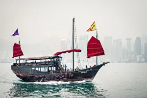 Aqua Luna traditional Junk ship sailing in Victoria Harbor, Tsim Sha Tsui, Kowloon Aqua Luna traditional Junk ship sailing in Victoria Harbor, Tsim Sha Tsui, Kowloon