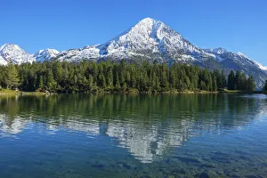 Arni lake with Bristen mountain at fall, Uri, Switzerland Arni lake with Bristen mountain at fall, Uri, Switzerland