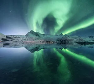 Aurora borealis over a lake near Svolvaer, Lofoten islands, Norway Aurora borealis over a lake near Svolvaer, Lofoten islands, Norway