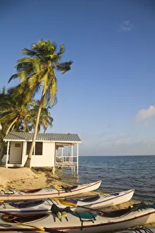 Belize, Tobaco Caye, Kayaks on beach by hotel cabanas Belize, Tobaco Caye, Kayaks on beach by hotel cabanas