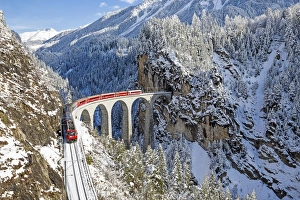Bernina train at Landwasser viaduct, Unesco world heritage, Engadine, Switzerland Bernina train at Landwasser viaduct, Unesco world heritage, Engadine, Switzerland