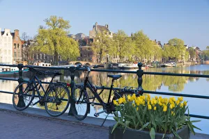 Bicycles on bridge, Amstel River, Amsterdam, Netherlands Bicycles on bridge, Amstel River, Amsterdam, Netherlands