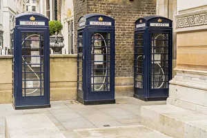 Three blue phone box's outside the Royal Academy of Arts, designed by Max Boyla, Mayfair, London, England, UK Three blue phone box's outside the Royal Academy of Arts, designed by Max Boyla, Mayfair, London, England, UK