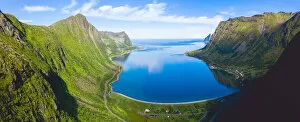 Norway Collection: Blue sea of fjord framed by Husfjellet mountain in summer, aerial view, Steinfjord, Senja