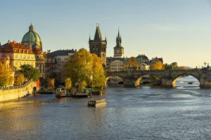 Boat going towards Charles Bridge and Old Town Bridge Tower, Prague, Bohemia, Czech Republic Boat going towards Charles Bridge and Old Town Bridge Tower, Prague, Bohemia, Czech Republic