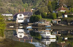 Boats and houses beside the River Yealm in the picturesque South Hams village of Newton Boats and houses beside the River Yealm in the picturesque South Hams village of Newton