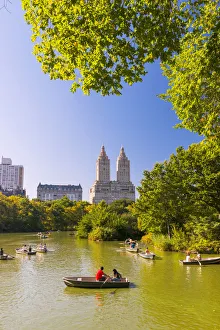 Boats on the Lake and Bow bridge in Central park, New York, USA Boats on the Lake and Bow bridge in Central park, New York, USA