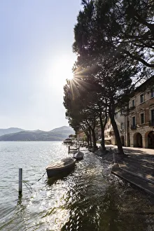 Boats on the lakefront of the small town of Morcote during a spring day, Canton Ticino Boats on the lakefront of the small town of Morcote during a spring day, Canton Ticino