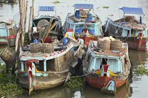 Boats moored on canal, Vinh Long, Mekong Delta, Vietnam Boats moored on canal, Vinh Long, Mekong Delta, Vietnam