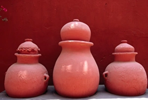 Bouganvillea and painted earth jars decorate a garden Bouganvillea and painted earth jars decorate a garden