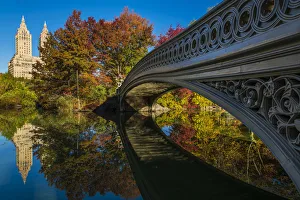 Bow Bridge reflected into the lake, Central Park, Manhattan, New York, USA Bow Bridge reflected into the lake, Central Park, Manhattan, New York, USA