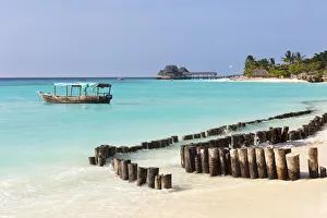 A breakwater and boat, Kendwa Beach, Zanzibar, Tanzania A breakwater and boat, Kendwa Beach, Zanzibar, Tanzania