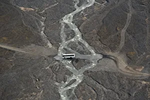 A bus crossing a river at Porsmork, Icelandic highlands, Iceland A bus crossing a river at Porsmork, Icelandic highlands, Iceland