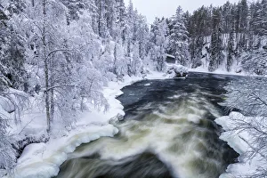 Cabin in Winter on Kitka River, Oulanka National Park, Kuusamo, Finland Cabin in Winter on Kitka River, Oulanka National Park, Kuusamo, Finland