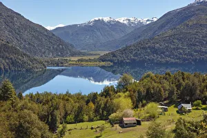 Cabins on Lake Rivadavia, with the Andes mountains in background, Los Alerces National Park, Chubut, Patagonia Cabins on Lake Rivadavia, with the Andes mountains in background, Los Alerces National Park, Chubut, Patagonia