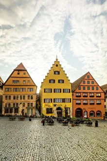 Cafes and colourful buildings at the market square, Rothenburg ob der Tauber, Germany Cafes and colourful buildings at the market square, Rothenburg ob der Tauber, Germany