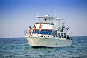 Central America, Belize, models on a motor yacht on the cayes Central America, Belize, models on a motor yacht on the cayes