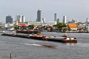 Chao Phraya river and the modern Bangkok skyline, Bangrak district, Bangkok, Thailand Chao Phraya river and the modern Bangkok skyline, Bangrak district, Bangkok, Thailand
