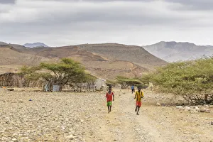 Children running in Melabday ethiopian village, Asso Bhole, Dallol, Danakil Depression Children running in Melabday ethiopian village, Asso Bhole, Dallol, Danakil Depression