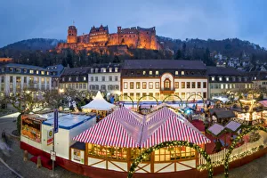 Christmas market at the Karlsplatz in Heidelberg with view towards the Heidelberg castle