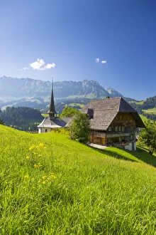 Church and farmhouse in a village in the Emmental Valley, Berner Oberland, Switzerland Church and farmhouse in a village in the Emmental Valley, Berner Oberland, Switzerland