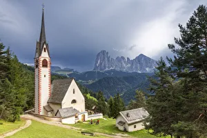 Church of San Giacomo with Sassolungo Group in the background. Ortisei, Gardena Valley Church of San Giacomo with Sassolungo Group in the background. Ortisei, Gardena Valley