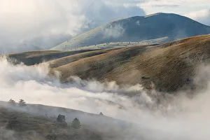 Cloudscape and wild landscape in Abruzzo, Italy. Hills at sunset Cloudscape and wild landscape in Abruzzo, Italy. Hills at sunset