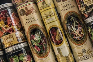 Colorful Italian pasta tin packaging containers on sale in a drugstore of Trastevere Colorful Italian pasta tin packaging containers on sale in a drugstore of Trastevere