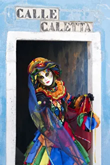 Colourful costume worn during the Venice Carnival on the island of Burano, Venice Colourful costume worn during the Venice Carnival on the island of Burano, Venice