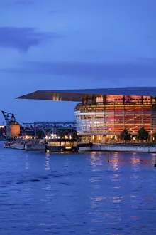 Copenhagen Opera House reflecting in the canal by night, Denmark Copenhagen Opera House reflecting in the canal by night, Denmark