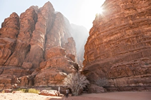 Couple taking photograph, Canyon, Wadi Rum, Jordan Couple taking photograph, Canyon, Wadi Rum, Jordan