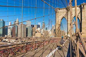 Cycling over the Brooklyn Bridge, New York, USA Cycling over the Brooklyn Bridge, New York, USA