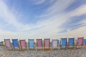 Deckchairs on pebble beach, Sidmouth, Devon, UK Deckchairs on pebble beach, Sidmouth, Devon, UK