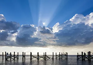 American Coastal Landscapes Prints: Dramatic clouds and sunbeams over a blue sky. Lake Pontchartrain, New Orleans, Louisiana
