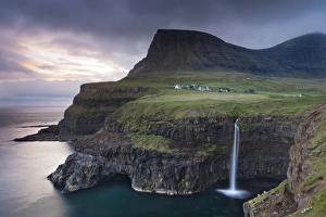 Dramatic coastal scenery at Gasadalur on the island of Vagar, Faroe Islands. Spring Dramatic coastal scenery at Gasadalur on the island of Vagar, Faroe Islands. Spring