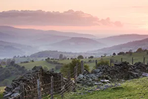 Dry stone wall on the slopes of Sugar Loaf mountain, looking towards the Usk Valley Dry stone wall on the slopes of Sugar Loaf mountain, looking towards the Usk Valley