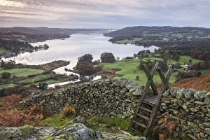 Dry stone wall and wooden stile above Lake Windermere, Lake District, Cumbria, England Dry stone wall and wooden stile above Lake Windermere, Lake District, Cumbria, England
