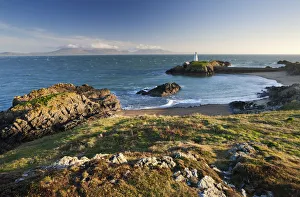 Early evening view of Pilots Cove and the beacon lighthouse T?r Bach on Llanddwyn Island Early evening view of Pilots Cove and the beacon lighthouse T?r Bach on Llanddwyn Island