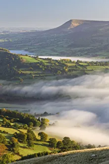 Early morning mist rolls over patchwork countryside in the Brecon Beacons National Park Early morning mist rolls over patchwork countryside in the Brecon Beacons National Park