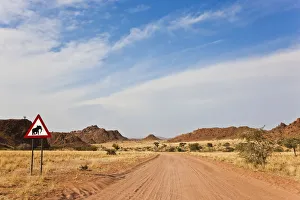 Elephant road sign & road, Damaraland, Namibia Elephant road sign & road, Damaraland, Namibia